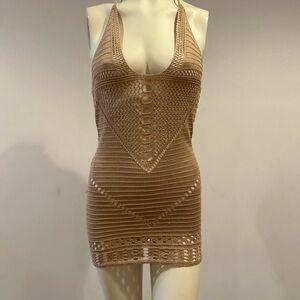 Swimsuit cover-up open back ties at the neck.  Never worn